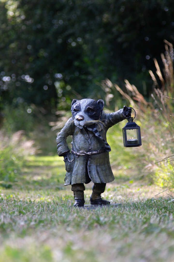 Bronze sculpture of badger from the wind in the willows